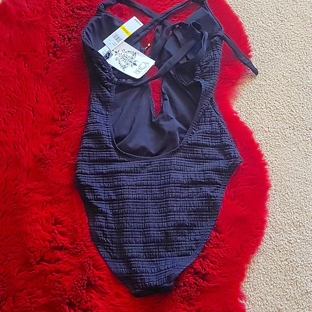 BECCA Very black swimsuit textured w/gold ring at chest plunge front hi legs NWT